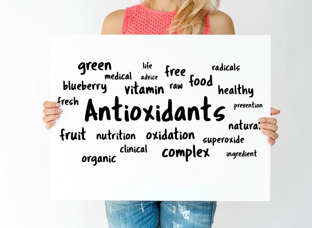 Holding a placard with antioxidants word map