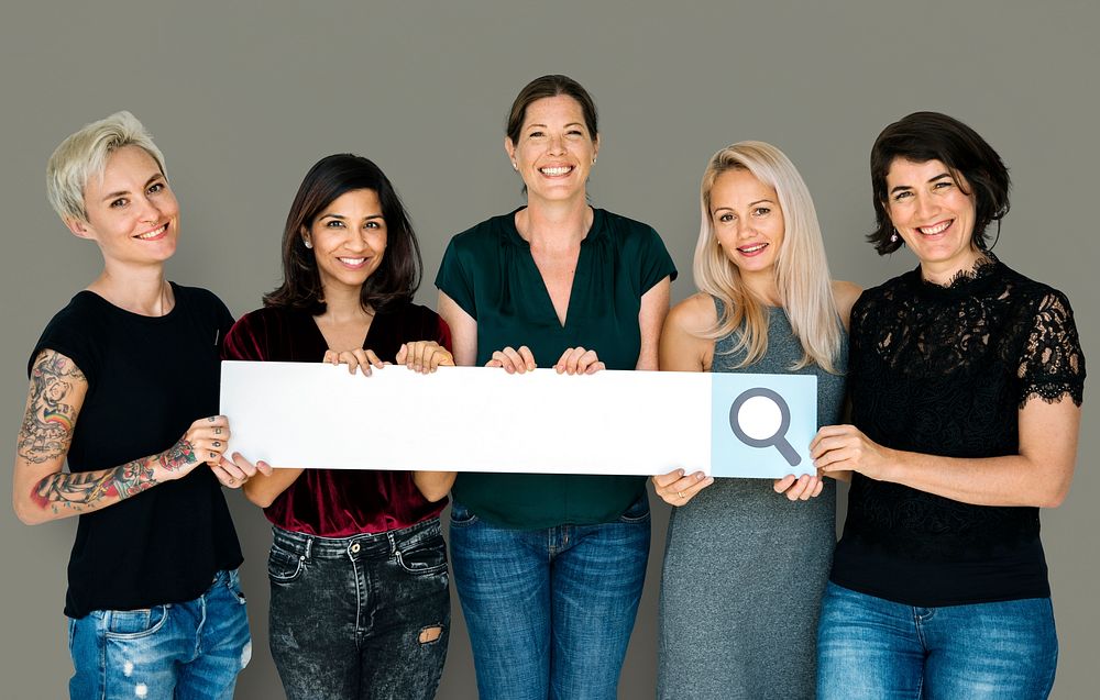 Group of women smiling and hodling search blank banner