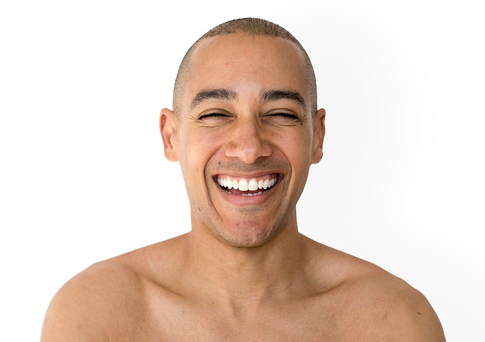 Skinhead man smiling with topless studio shoot