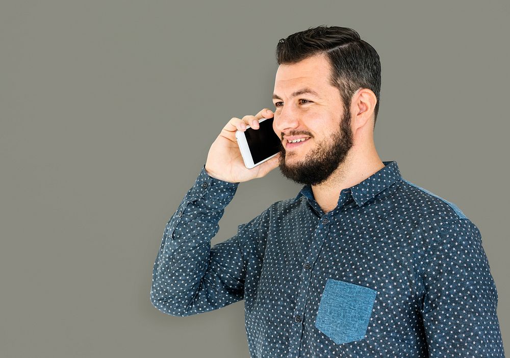 Man standing and using phone to pose for photoshoot