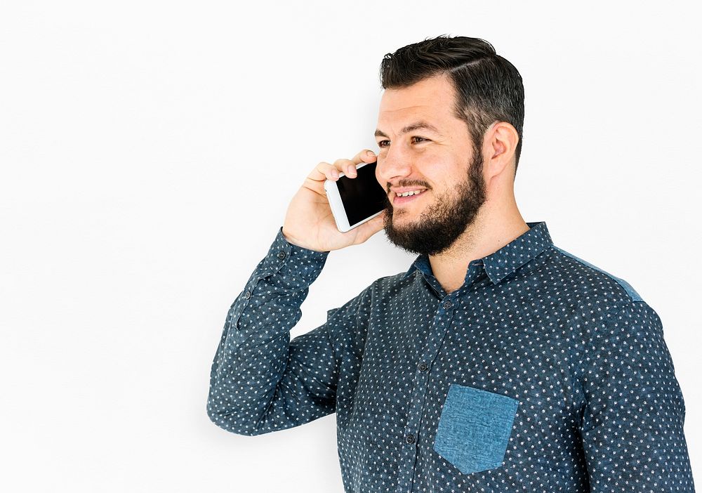 Man standing and using phone to pose for photoshoot