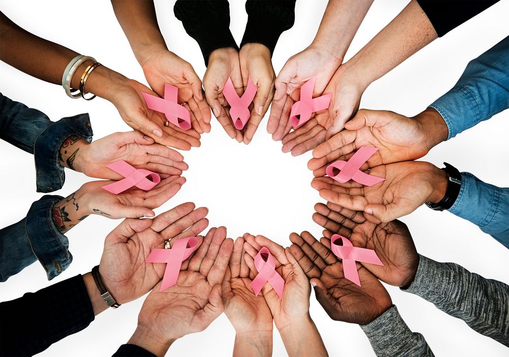 Women holding breast cancer awareness ribbons