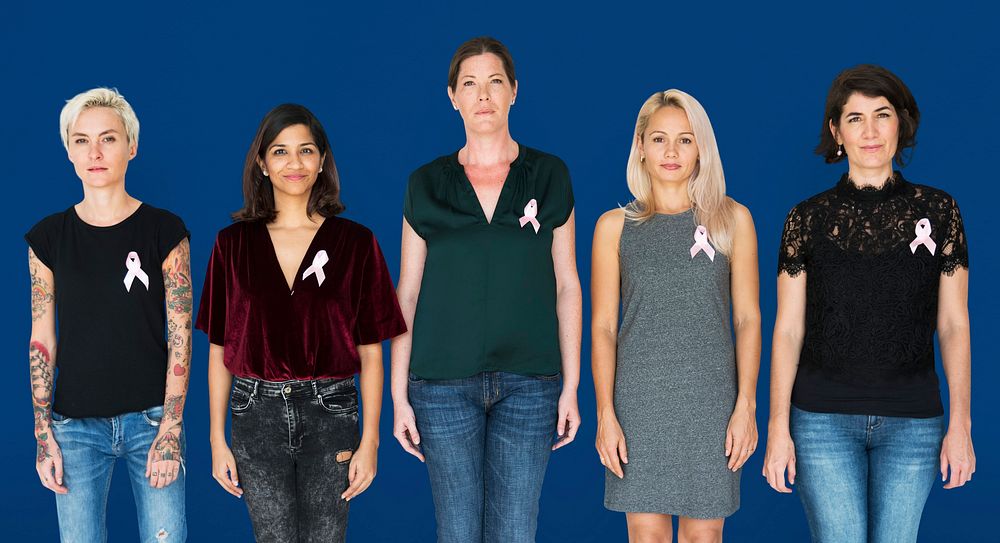 Group of women with pink ribbon for breast cancer awareness campaign