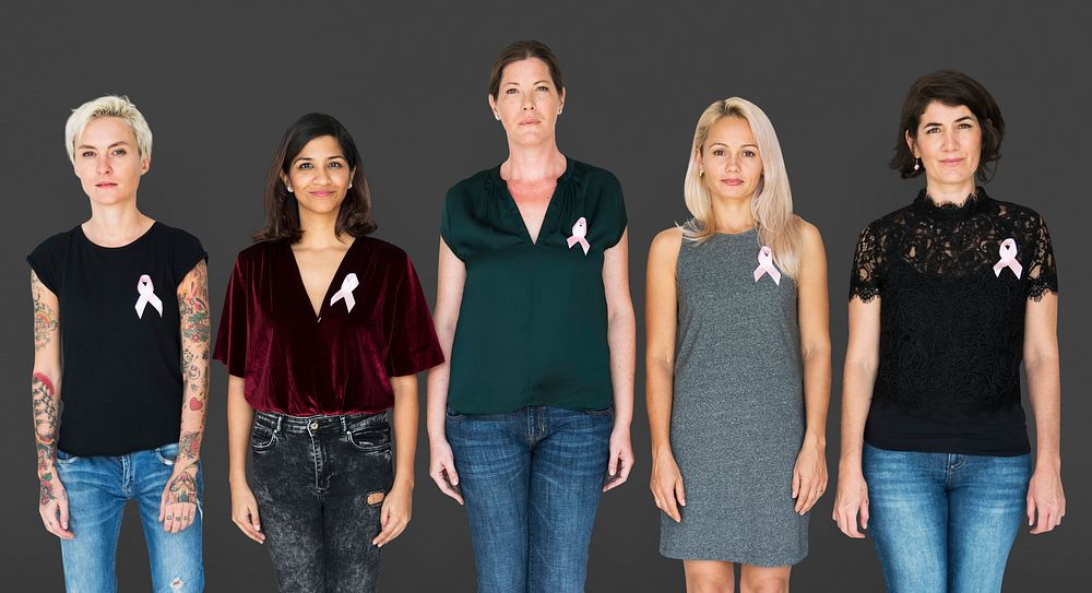 Group of women with pink ribbon for breast cancer awareness campaign