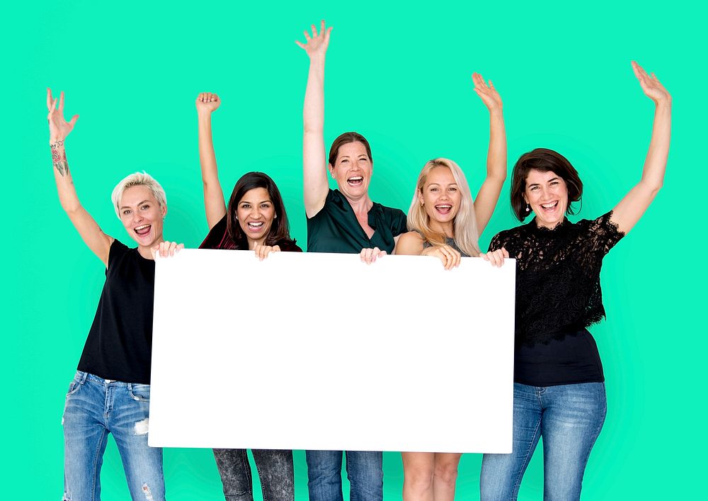 Happiness group of women arms raised and holding blank banner