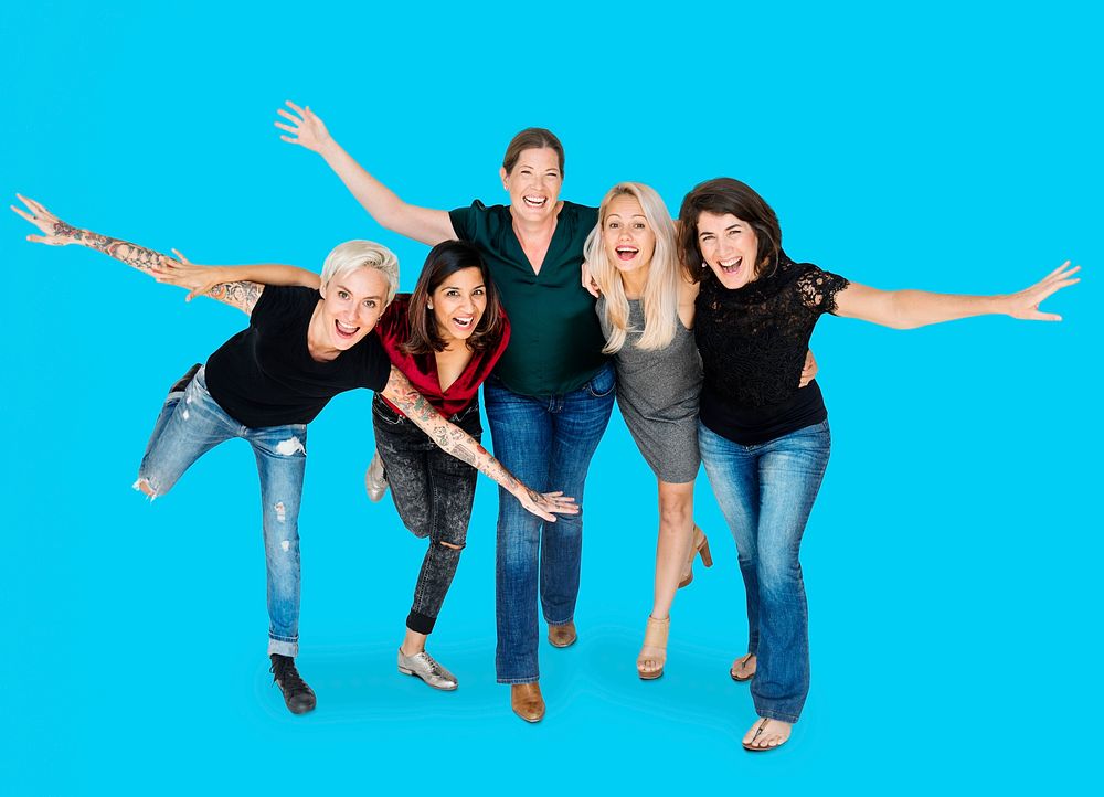Happiness group of women arms stretched and huddle playful