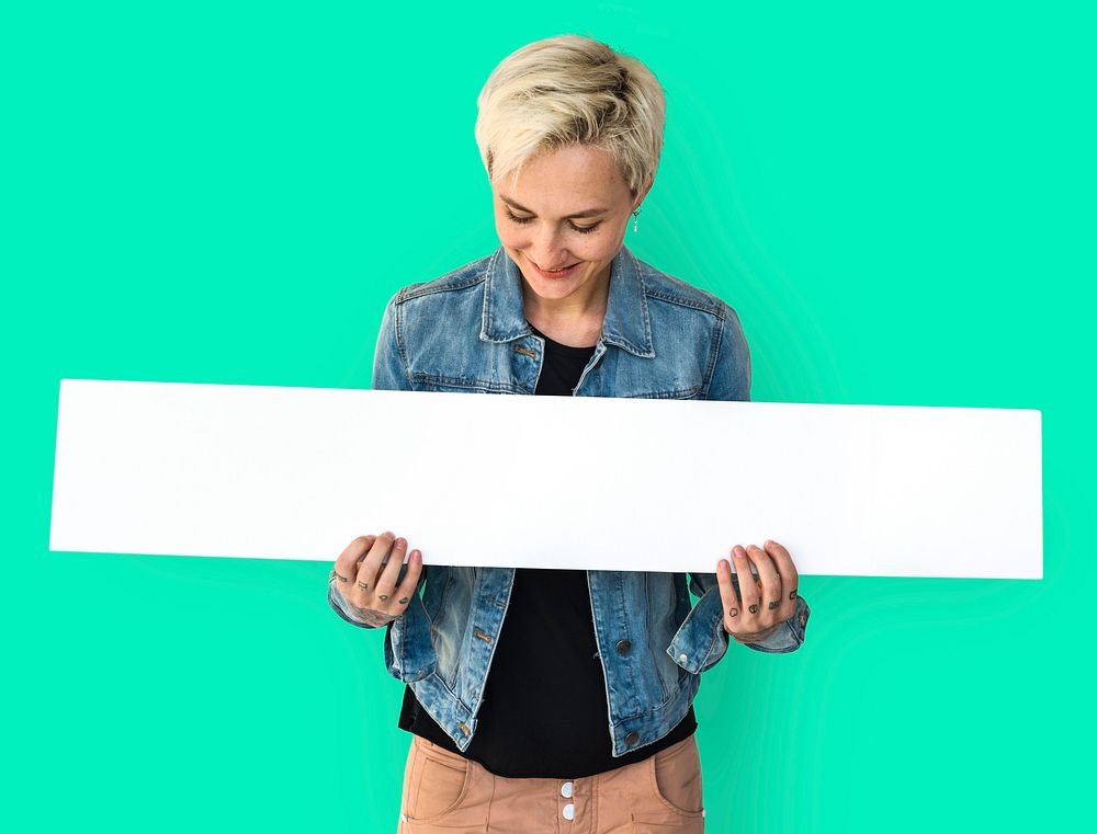 Portrait of a woman holding a blank signage