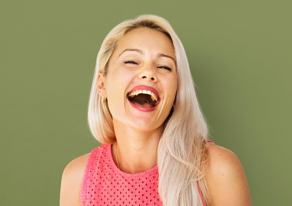 Caucasian woman face expression laughing and smiling