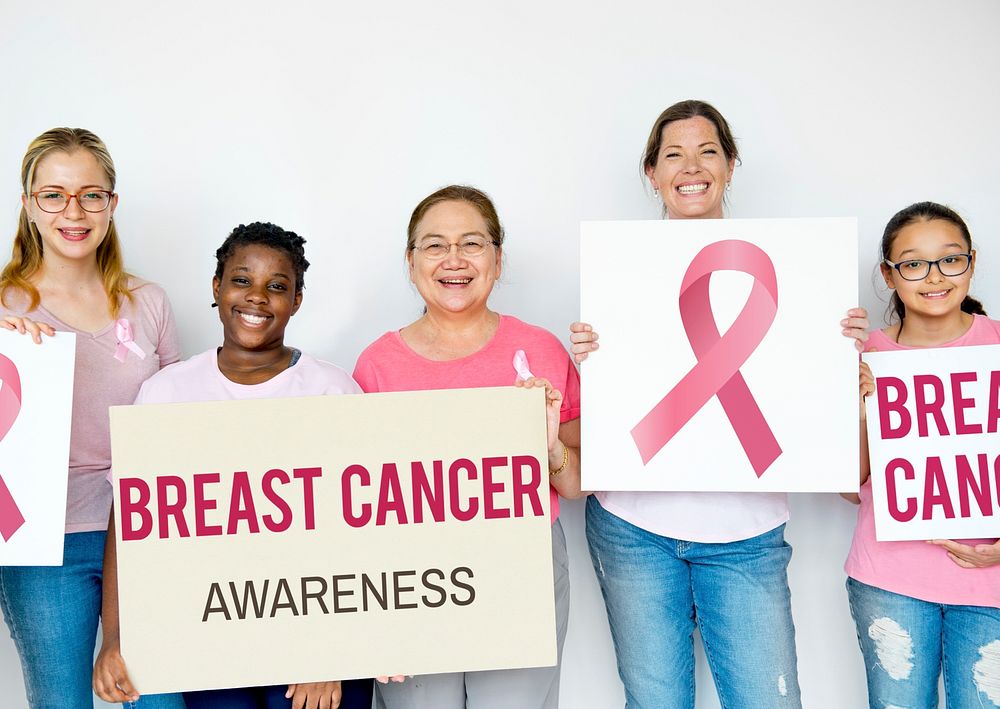 Diverse woman with breast cancer awareness poster