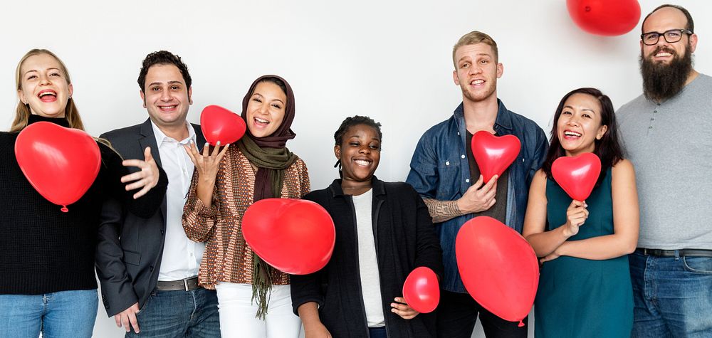 People with heart shaped balloons