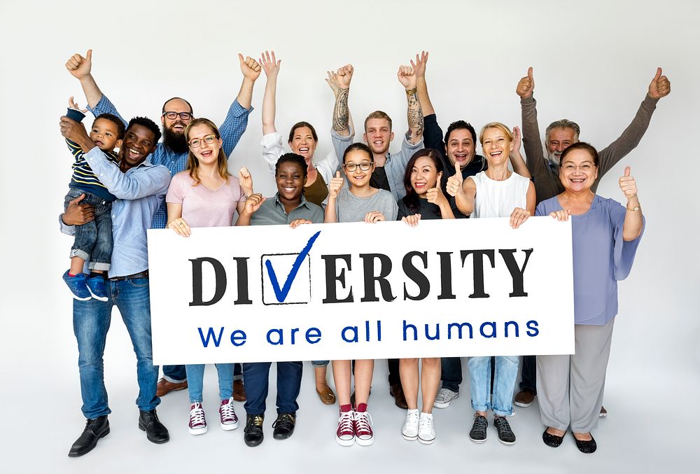 Group of people holding a diversity poster