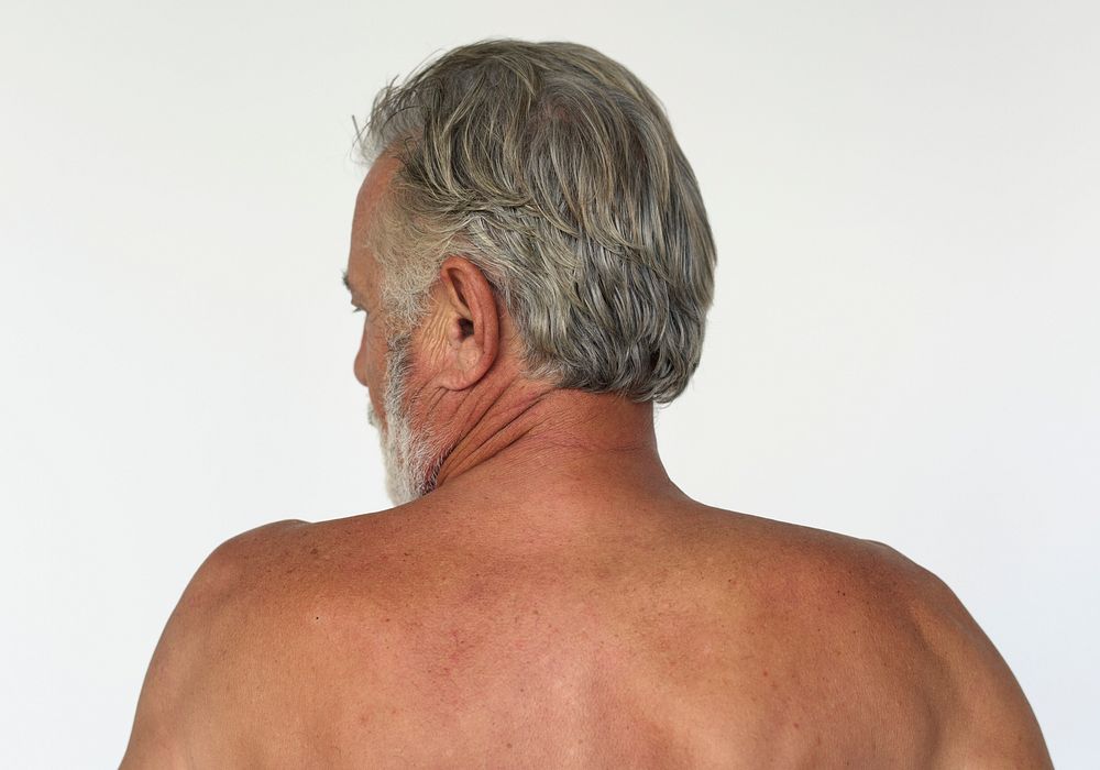 Man shirtless rear view studio portrait
