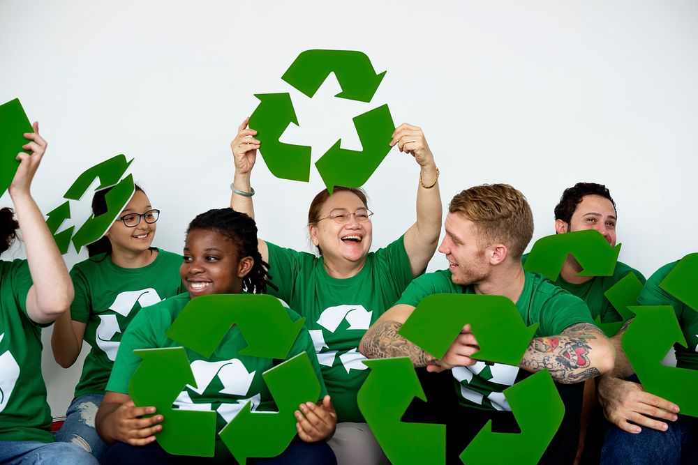 Ecology group of people smiling and holding recycle symbol