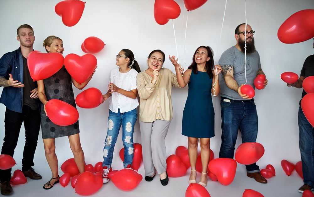 Happiness group of people with love heart shape balloon
