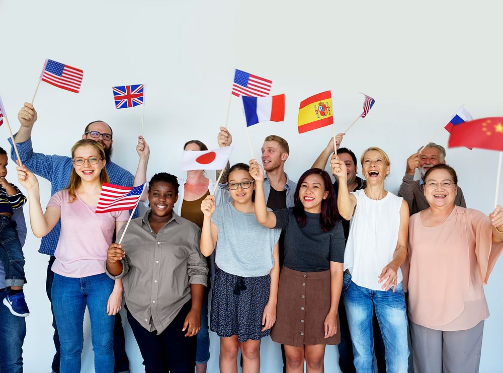 Group of people holding national flags studio portrait