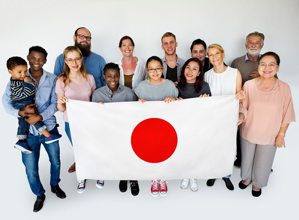 Group of people holding flag of Japan