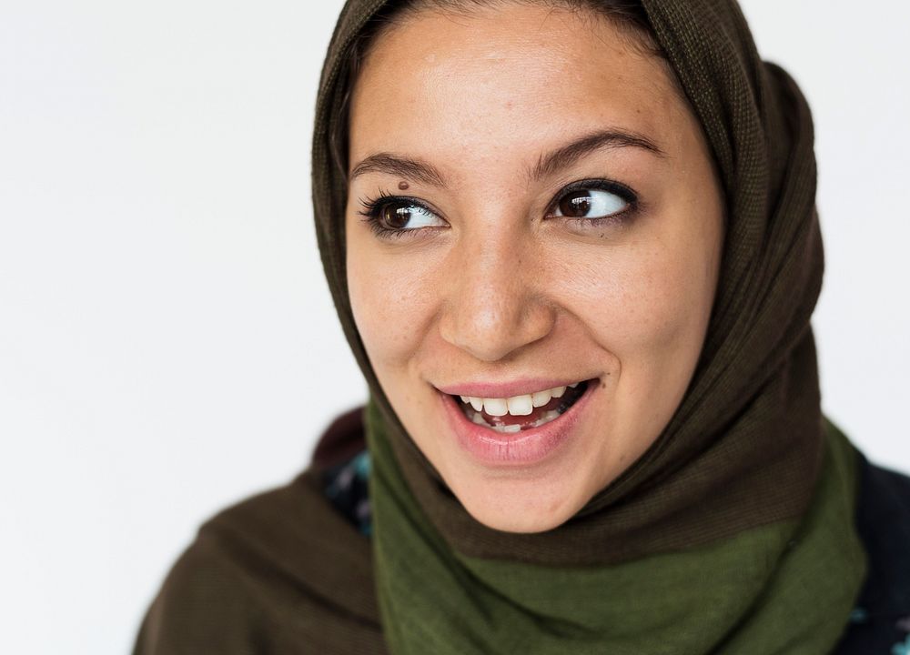 Happiness middle eastern woman smiling casual studio portrait