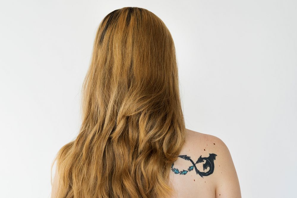 Adult Blonde Woman Back On with Tattoo Studio Portrait