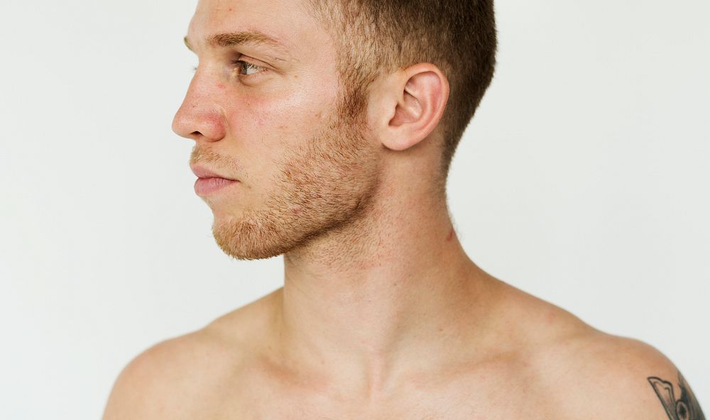 Man bare chest studio portrait