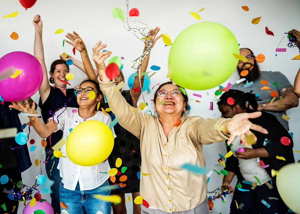 Group of Diverse People with Party Balloons Confetti