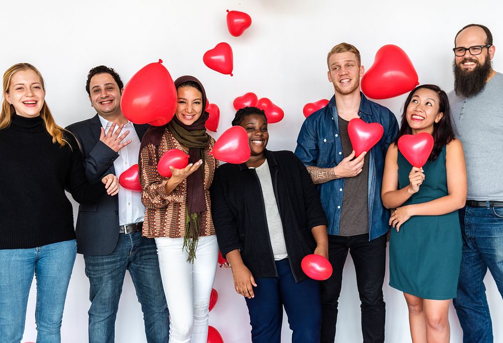 Group of Diverse People Holding Heart Balloons Cheerful
