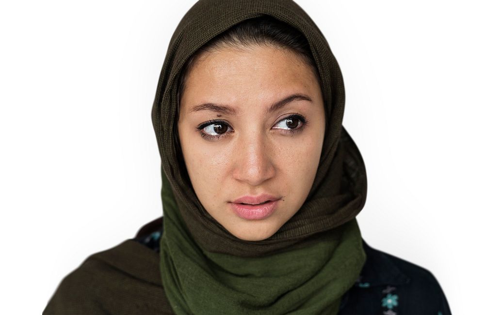 Face portrait of a teary eyed woman with a scarf