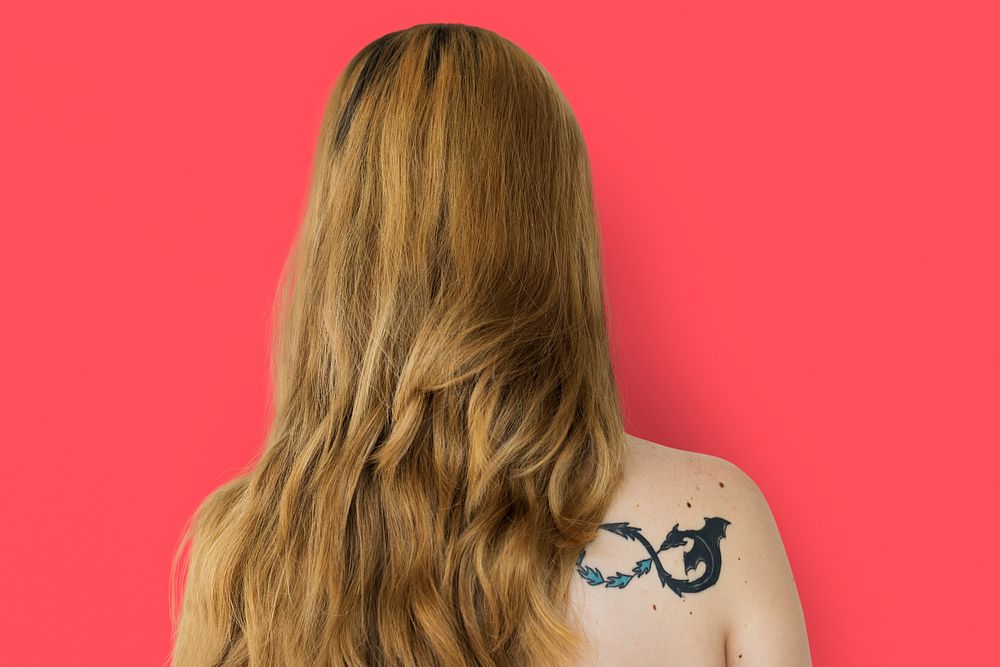 Young Adult Woman Back with Tattoo Studio Portrait