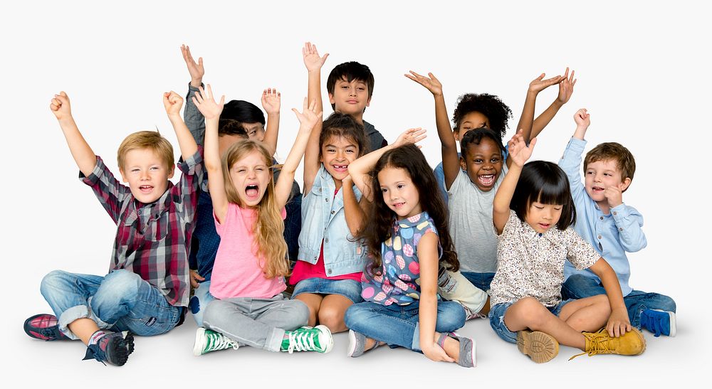 Cheerful children having a great time together with their hands raised