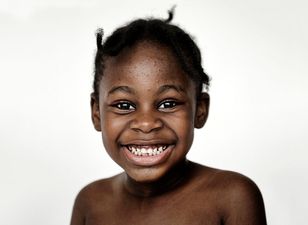 Portrait of young African girl on white background