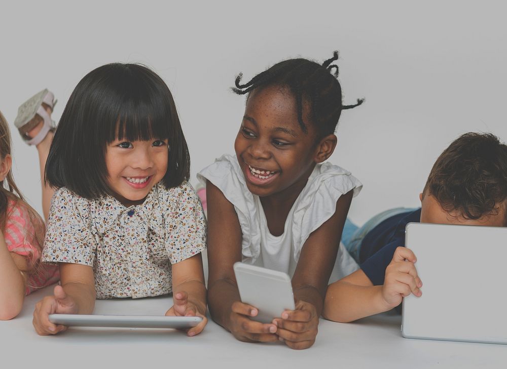 Group of kids using digital devices