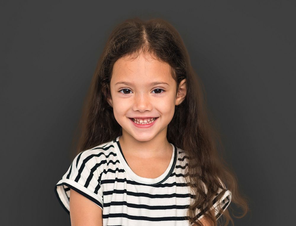 Little girl smiling casual studio portrait