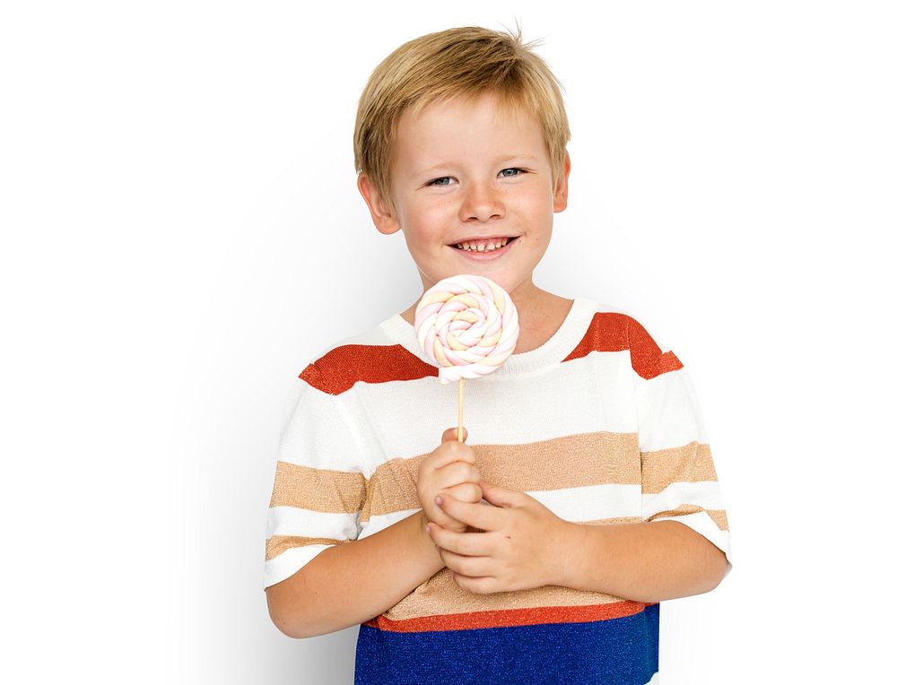 Cute blond boy with a big lollipop
