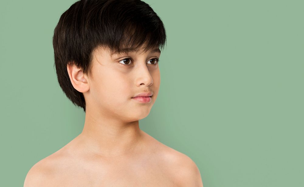 Young Boy with Serene Face Expression Studio Portrait