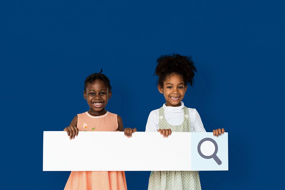 Little girl smiling and holding blank search placard
