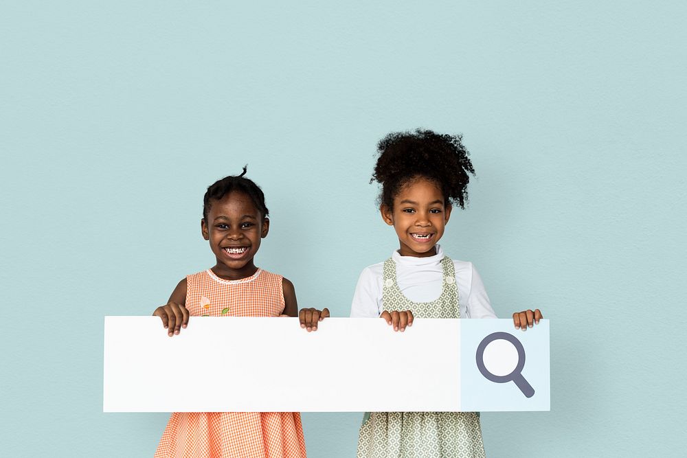 Little girl smiling and holding blank search placard