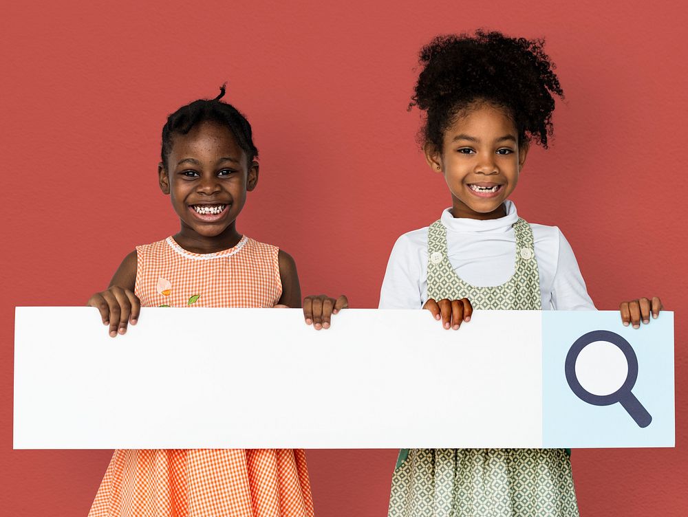 Little girl smiling and holding blank search placard