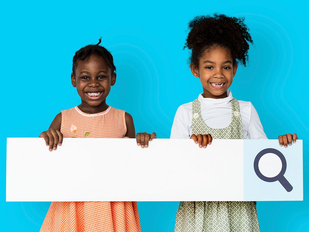 Little girl smiling and holding blank search placard