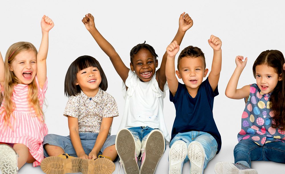 Diverse Group Of Happy Kids Holding Hands Up