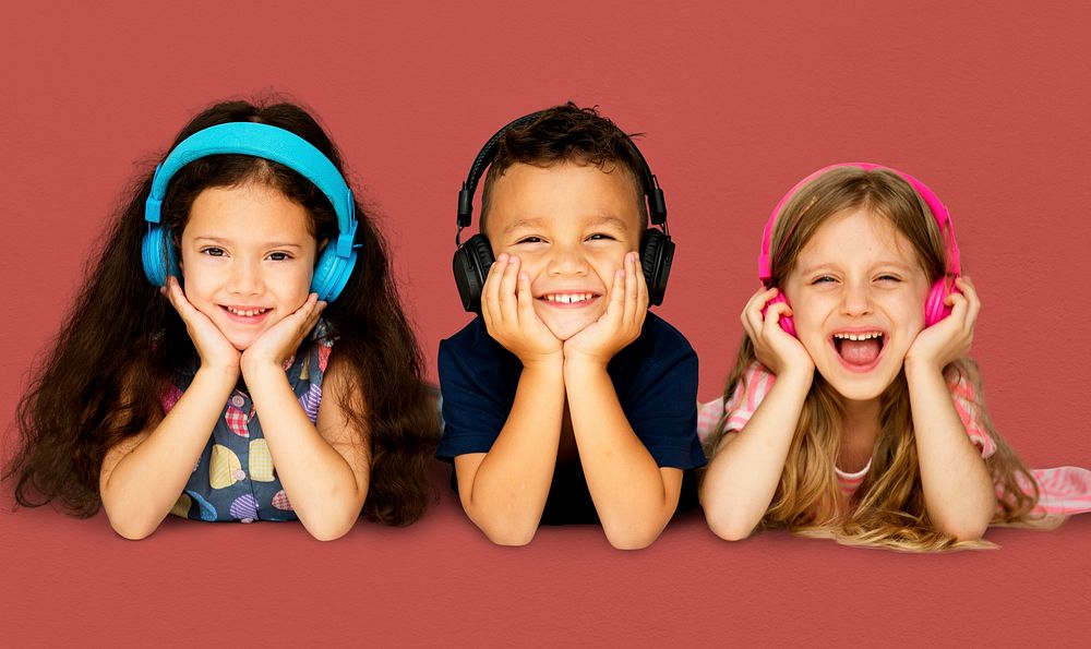 Diverse Group Of Kids Lying and Listen to Music In a Headphones