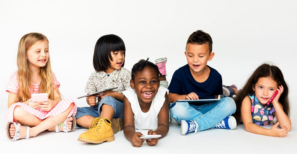 Group of kids using digital devices