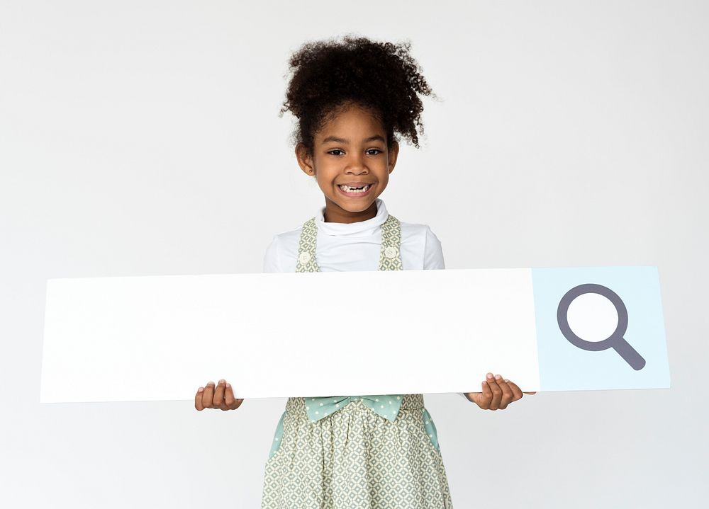 Kid holding search bar icon for studio shoot