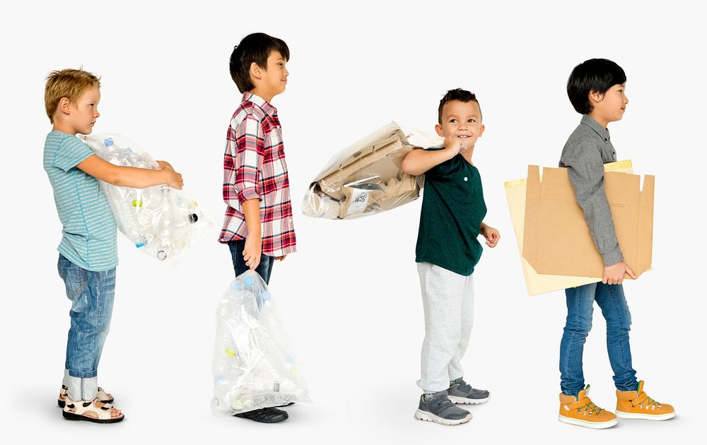 Group of little boys carrying trash to recycle