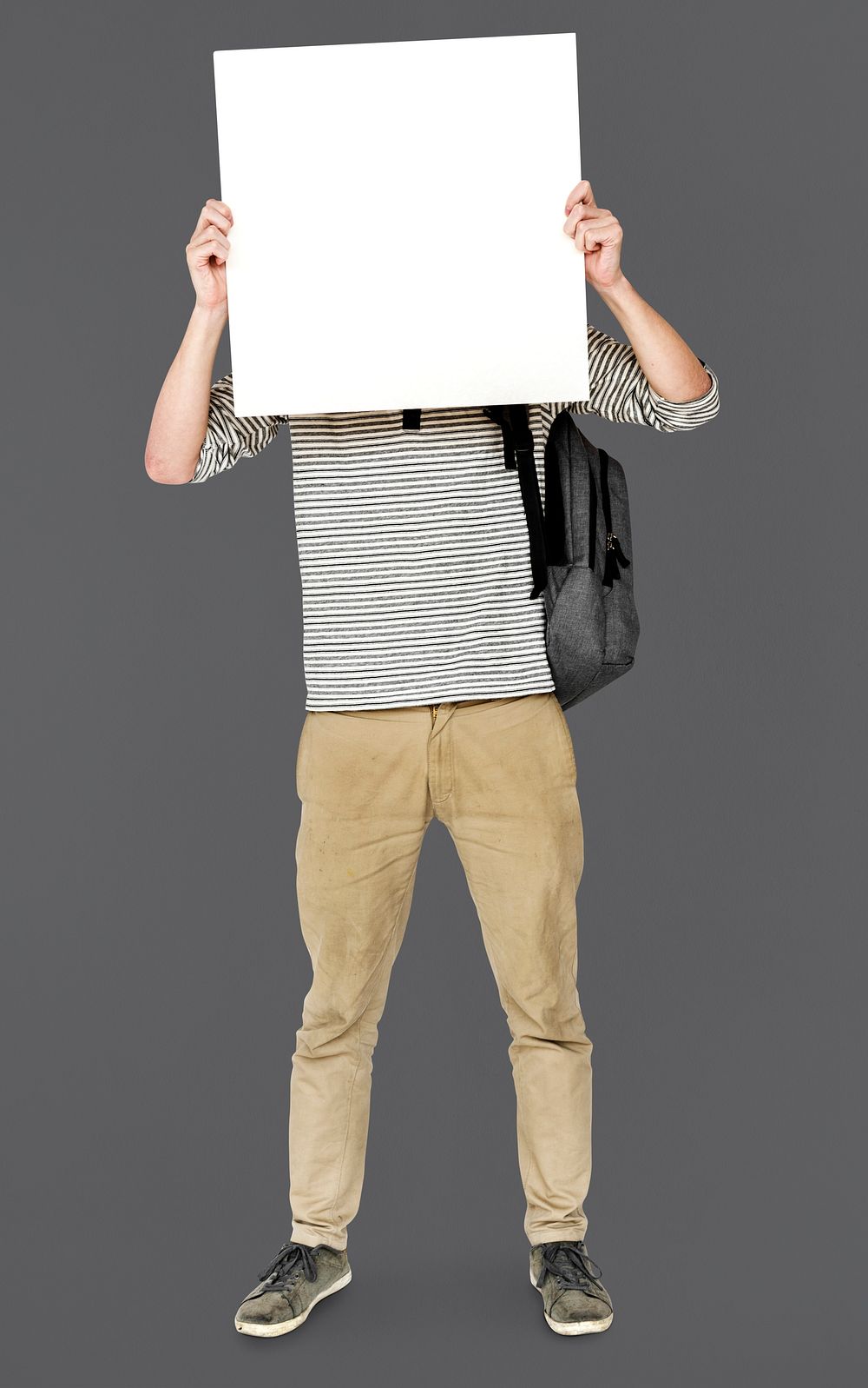 Young Adult Man Holding Blank Paper Board Studio Portrait