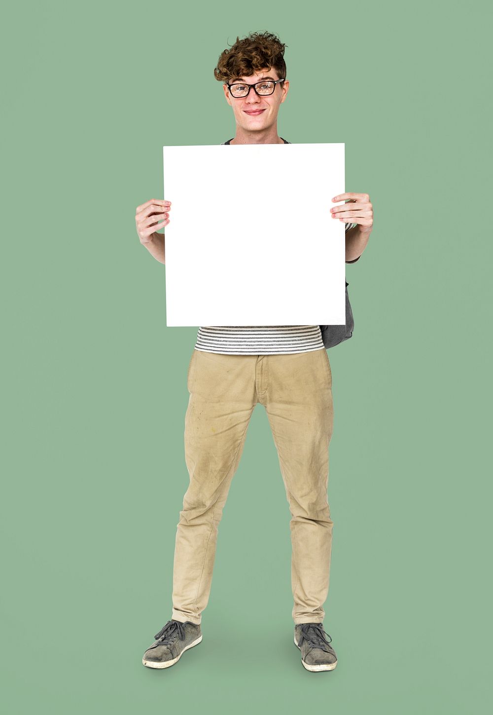 Young Adult Man Holding Blank Paper Board Studio Portrait