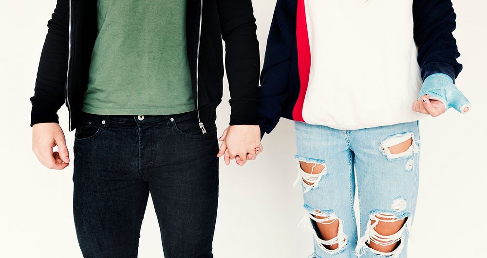 Young couple holding hand love closeness