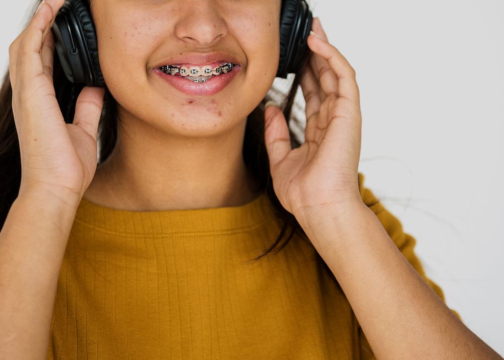 A Cheerful Girl with Headphone