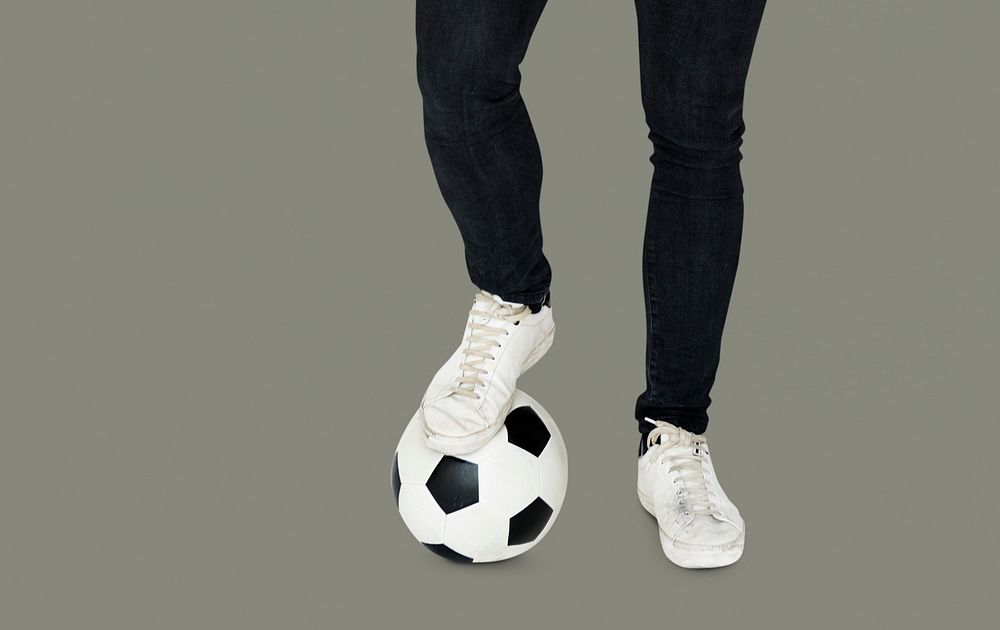 Pair of Legs with Soccer Ball Studio Portrait