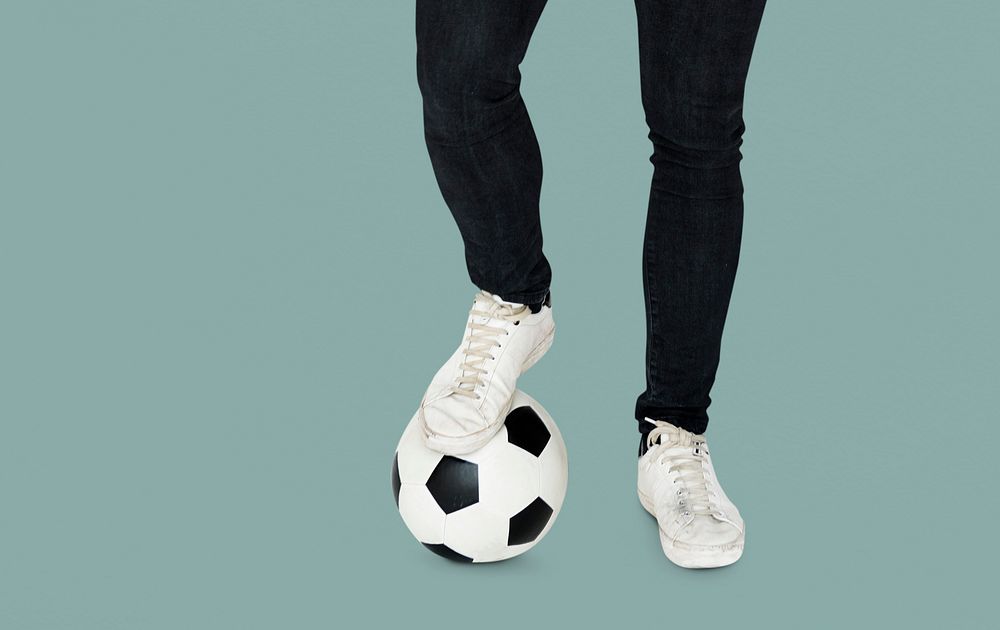 Pair of Legs with Soccer Ball Studio Portrait