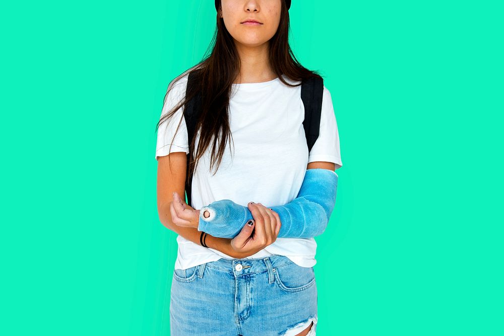 Young Adult Woman with Broken Arm Studio Portrait