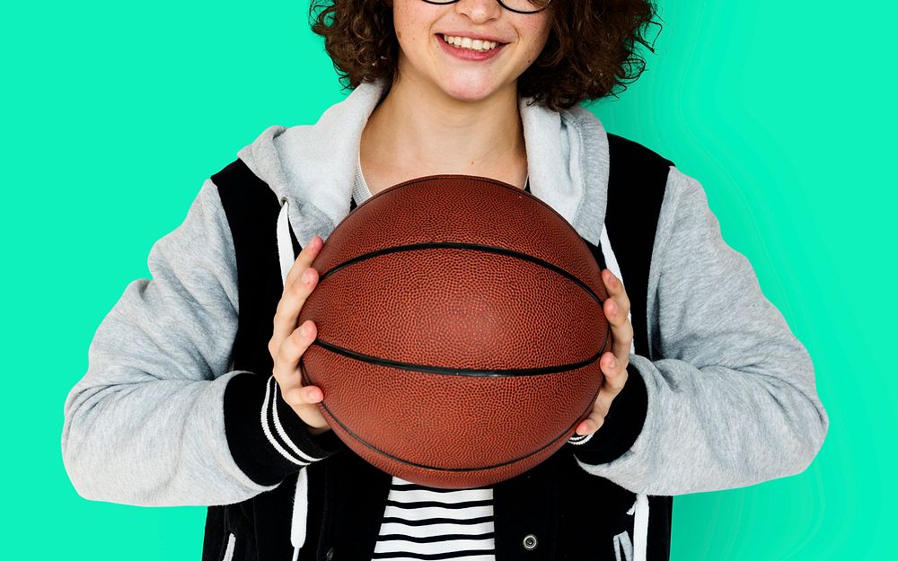 Young Adult Woman with Basketball Studio Portrait